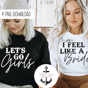 May include: Two white sweatshirts with black text. One sweatshirt says "Let's Go Girls" and the other says "Man I Feel Like A Bride".