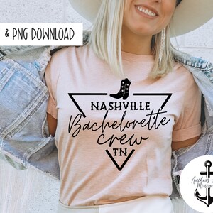 May include: A pink t-shirt with a black graphic design that says "Nashville Bachelorette Crew TN" with a boot graphic. The graphic is inside a black triangle. The shirt is being worn by a person.