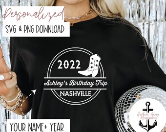 May include: A black t-shirt with a white circle design featuring a pair of cowboy boots, the year 2022, the text "Ashley's Birthday Trip", and the word "NASHVILLE". The text "YOUR NAME + YEAR" is also visible at the bottom of the shirt.