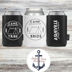 May include: Three drinks insulators with camping designs. One black insulator reads "CAMP Bachelorette TRIBE", another white insulator says "CAMP Bachelorette BRIDE", and a third black insulator says "ASHEVILLE North Carolina".