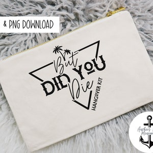 May include: A white canvas zippered pouch with black text that reads "But Did You Die" in a triangle shape with palm trees at the top. The text "Hangover Kit" is written vertically below the triangle. A black anchor logo is in the bottom right corner with the text "Anchors Away Monograms".