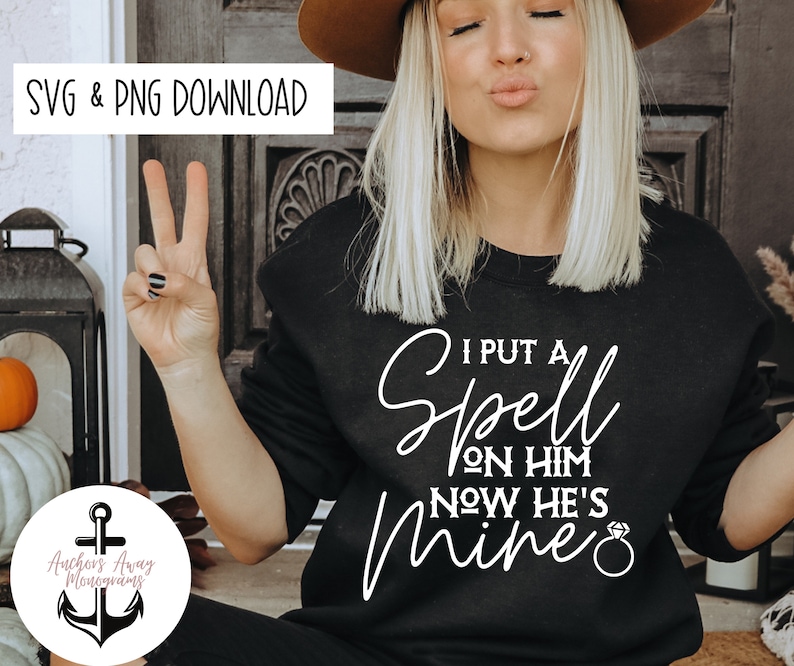 May include: A black sweatshirt with white text that reads "I put a spell on him now he's mine" with a diamond ring graphic.
