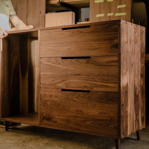 the “Santa Elena” cabinet with Mini Fridge / Wine Cooler, 3 drawers for storage, tapered legs & multiple wood options