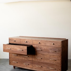 The “Levine Dresser”, Mid Century Modern Hardwood Dresser with a Gallery Rail & Hand Cut Joinery. Fully Customizable Sizing and Drawers.