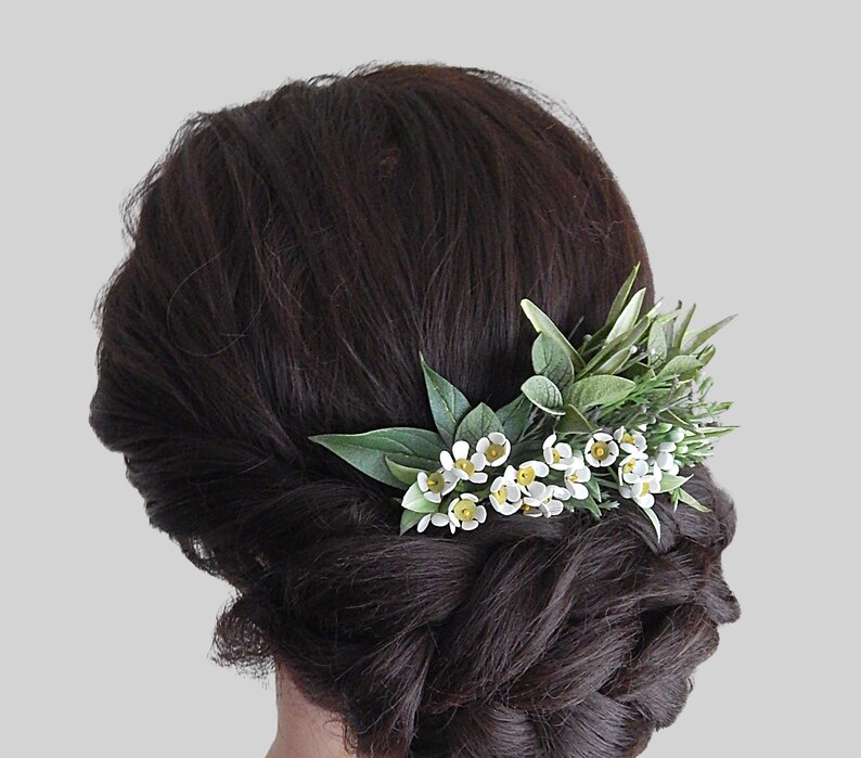 Floral hair comb with white wax flowers and green leaves