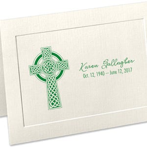 May include: A white card with a green Celtic cross and the text "Karen Gallagher Oct. 12, 1940 - June 12, 2017".