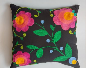 Hand embroidered floral cushion.