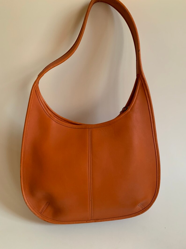 coach small town bucket bag with heart floral print