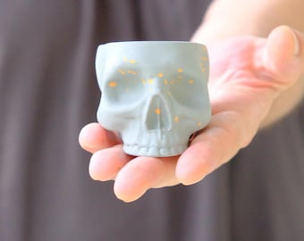 Handmade Gothic Skull Espresso Cup: Matte Gray Ceramic with Orange Splash