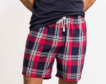 May include: Red and blue plaid shorts with a white drawstring.