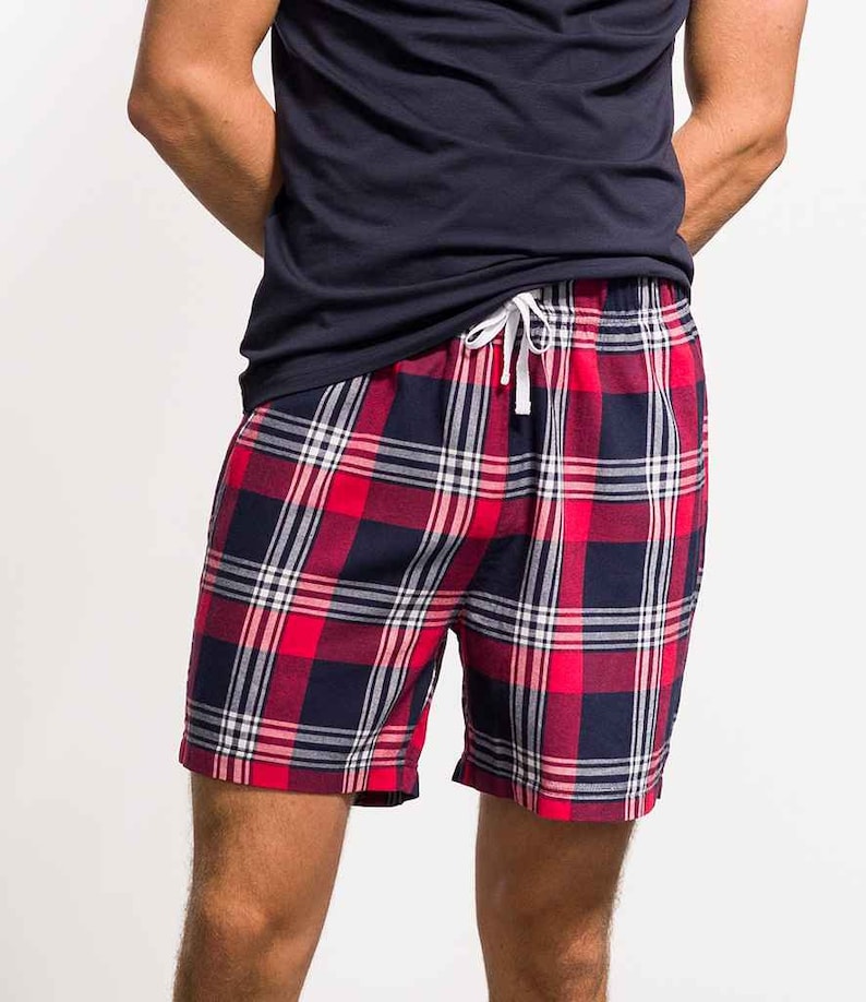 May include: Red and blue plaid shorts with a white drawstring.