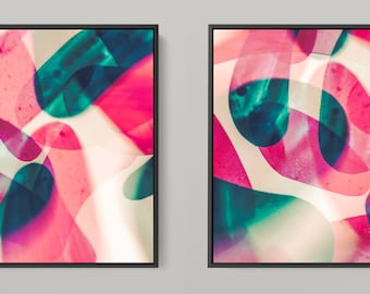 May include: Two abstract paintings with overlapping shapes in shades of pink, teal, and white.