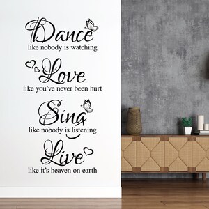 May include: Black and white wall decal with the text "Dance like nobody is watching, Love like you've never been hurt, Sing like nobody is listening, Live like it's heaven on earth". The decal features a butterfly graphic.