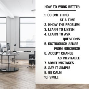 May include: A white wall with black text that reads "HOW TO WORK BETTER" followed by ten numbered points. The office setting includes a desk, computer, and chair. The text provides advice for improving work habits.