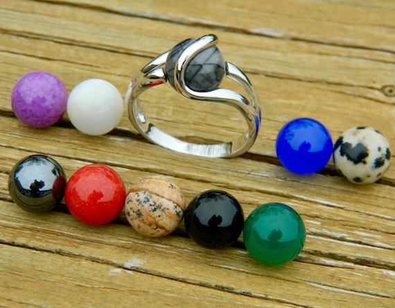 Ring with changeable balls deals