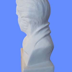 May include: A white plaster bust sculpture depicting the head and shoulders of a person with textured hair, shown in profile. The figure features a smooth, matte finish and rests upon a solid, rectangular base, capturing the neck and collar area.
