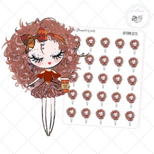 May include: An illustration of a doll-like figure with curly brown hair, a plaid bow, and a matching coffee cup. A sheet of stickers with the words "Autumn Latte" and matching doll images is also shown.