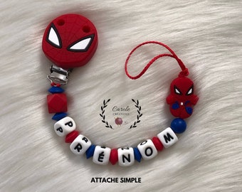 Attache tétine personnalisé en silicone (lettre prénom, clip et motif, perle ronde et lentille) modèle araignée, rouge et bleu