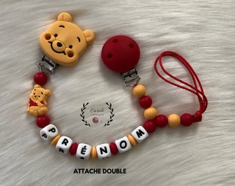 Attache tétine et doudou (attache double) en silicone (lettre prénom, clip et motif, perle ronde et lentille) winnie, rouge et jaune