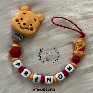 Personalized silicone pacifier clip (first name letter, clip and pattern, round bead and lens), Ourson model, yellow and red