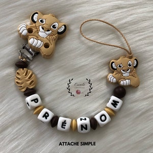 Pacifier clip entirely in silicone (first name letter, clip and pattern, round bead and lens) LION + savannah leaf, beige and brown