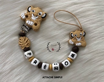 Attache tétine entièrement en silicone (lettre prénom, clip et motif, perle ronde et lentille) LION + feuille savane, beige et marron