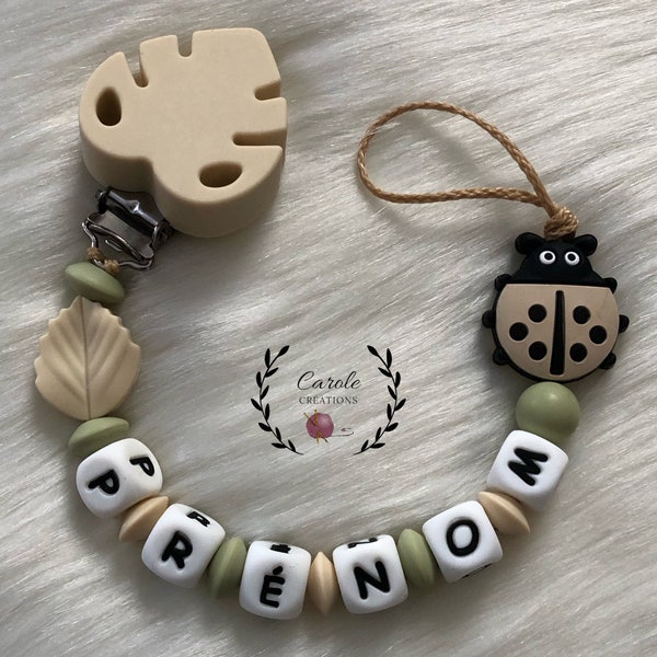 Attache tétine personnalisé en silicone (lettre prénom, clip et motif, perle ronde et lentille) coccinelle + feuille, kaki clair et beige