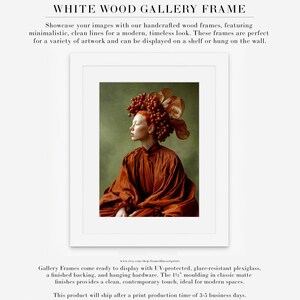 surreal female portrait wall art displayed in white wood gallery frame