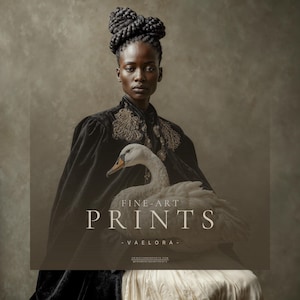 Vaelora fine art portrait of a Black woman in a black embroidered velvet cape holding a white swan against a soft taupe background.