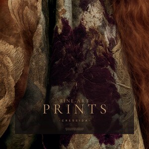Close detail from Cressida showing layered botanical textile patterns in antique gold, plum, brown and green beside copper-red hair.