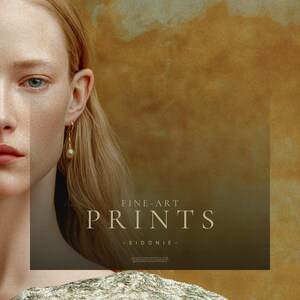 Close detail of Sidonie showing one blue-green eye, natural skin texture, gold pearl earring, blonde hair, and the textured sage and cream fabric of her dress.
