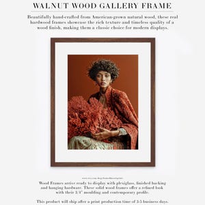 Kavya coral portrait displayed in walnut wood gallery frame with white mat
