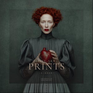 Woman in vintage dark gray pleated gown with red hair and bold red lipstick holding a red anatomical heart-shaped vessel, posed against a painterly green-gray background.