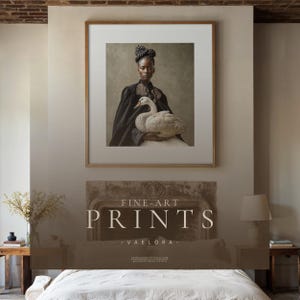 Large framed Vaelora woman-with-swan portrait displayed above a bed and stone fireplace in a warm neutral rustic bedroom.