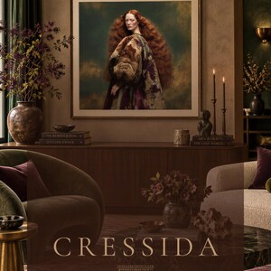 Large framed Cressida portrait displayed above a walnut console in a warm old-world modern interior with green, plum and bronze accents.