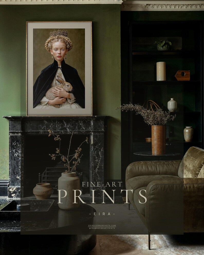 Eira framed fine art print displayed above black marble fireplace in a moody green living room with bookshelves and dark academia styling