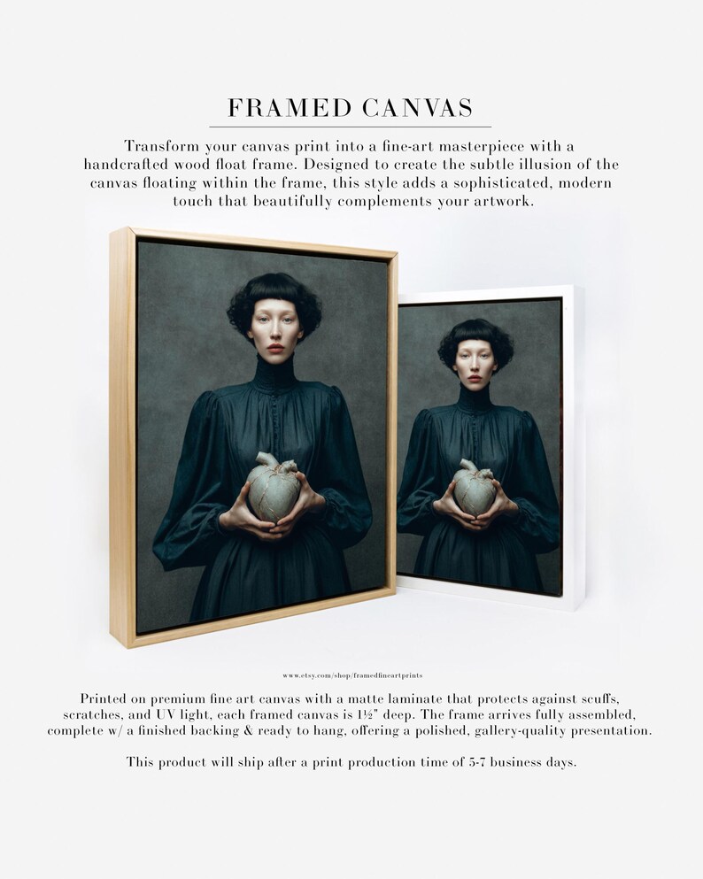 Framed canvas version of Sable, a woman in a dark dress holding a kintsugi heart, displayed in a handcrafted wood float frame for fine art presentation.