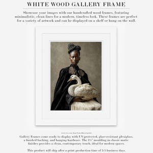 Vaelora portrait of a Black woman holding a white swan displayed in a white wood gallery frame with white matting.