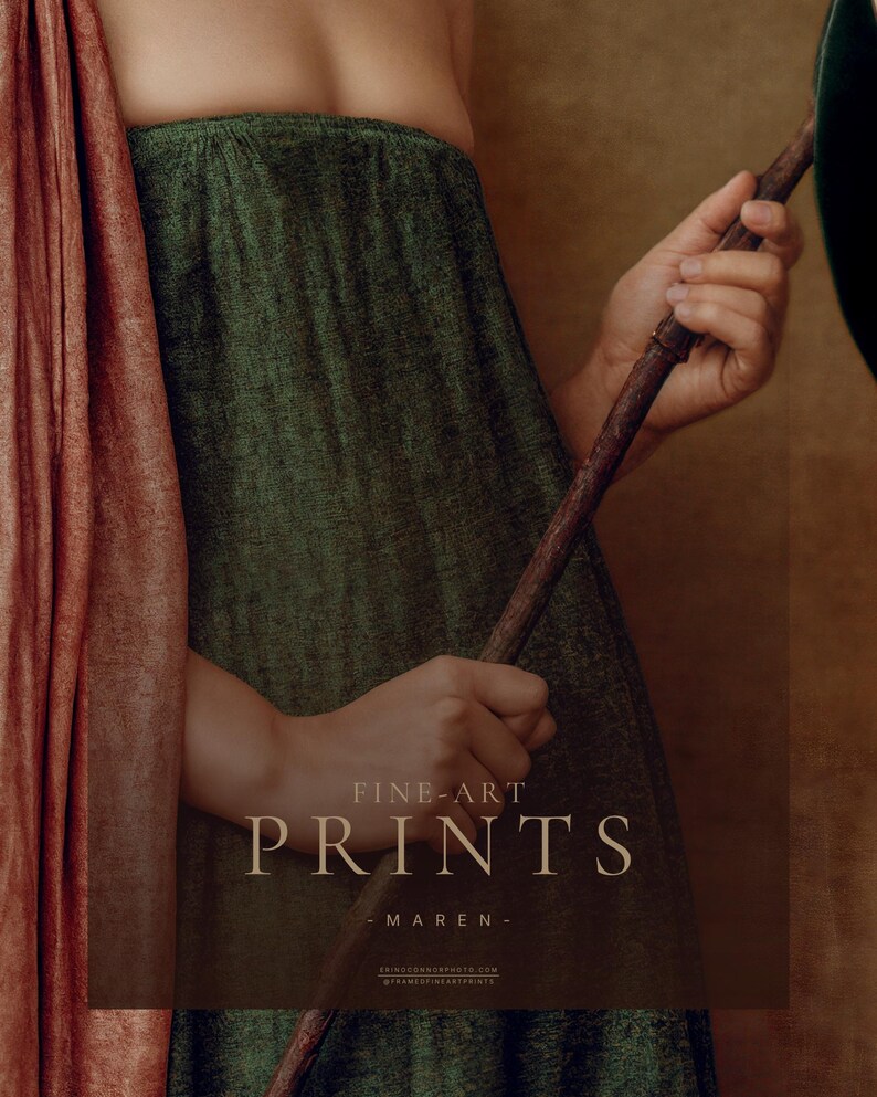 Detail of Maren's pregnant form and hands holding a magnolia branch against her textured botanical green dress and dusty rose drape.