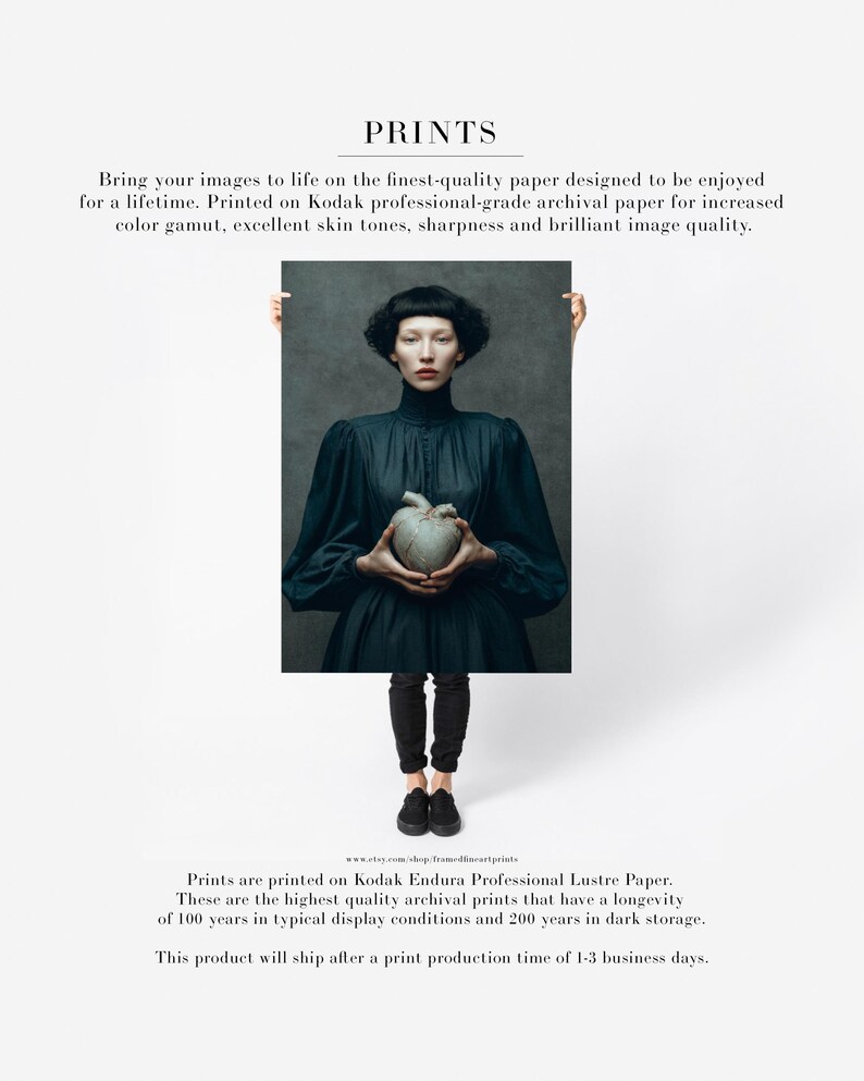Unframed fine art print of Sable holding a gray ceramic heart, with archival quality and sharp detail, printed on professional-grade paper.