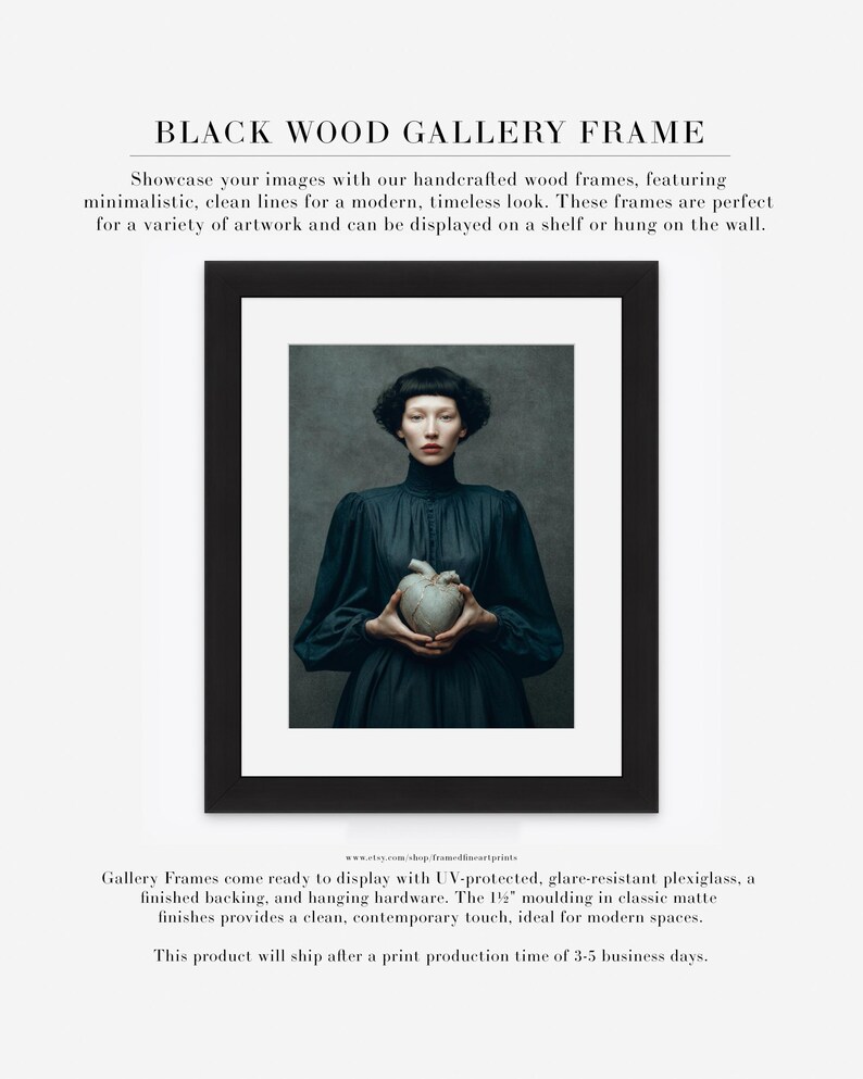 Fine art portrait of Sable framed in a black gallery frame with matte, showing a woman holding a symbolic ceramic heart against a painterly background.