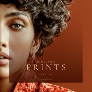 Close detail of Kavya fine art print showing eye, curls, earring, and rust textile against terracotta background