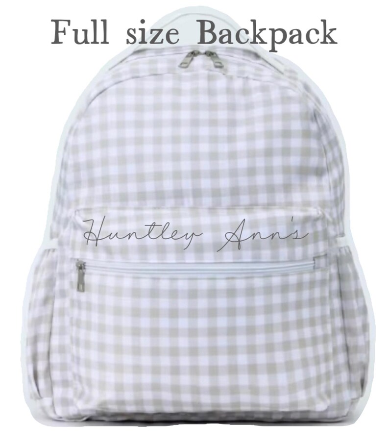 May include: A full-size backpack with a light gray and white gingham pattern. The backpack has a front zippered pocket and side pockets. The text "Full size Backpack" is at the top, and the text "Huntley Ann's" is on the front pocket.