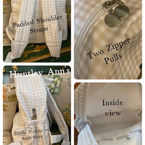 May include: A beige and white gingham backpack with padded shoulder straps, two zipper pulls, and elastic pockets on both sides. The interior is visible, and the bag has a simple, classic design.