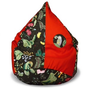 May include: A red and green beanbag chair with a whimsical owl design. The chair is made of fabric and has a round shape.