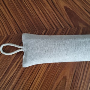 Minimalist Scandinavian style Linen draft window stopper with buckwheat hulls filling, fabric draft stop, rustic window snake, draft dodger
