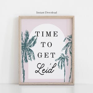 May include: Framed art print with a light wood frame. The print features a pink background with a white arch and teal palm trees. Text reads "TIME TO GET Leid" and "Instant Download".