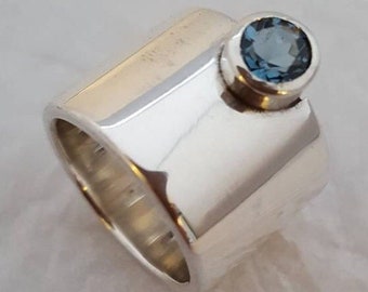 Contemporary 15mm Wide Band Sterling Silver Ring with Tube Set 6mm Facetted London Blue Topaz.