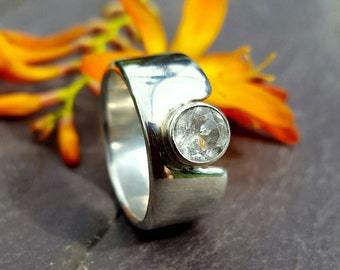 Contemporary 10mm Wide Band Sterling Silver Ring with Tube Set 6mm Facetted White Topaz.