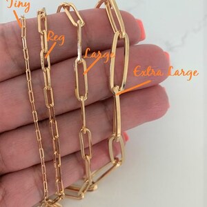 May include: Four gold chain necklaces of different sizes, labeled "Tiny", "Reg", "Large", and "Extra Large".